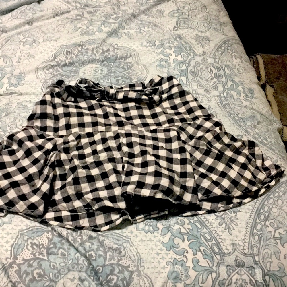 Plaid black and light grey mid skort, never worn, still with tags